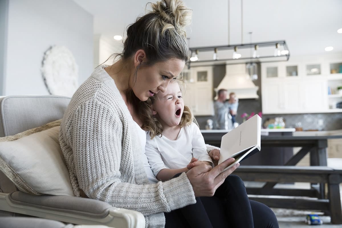 mom reading to daughter