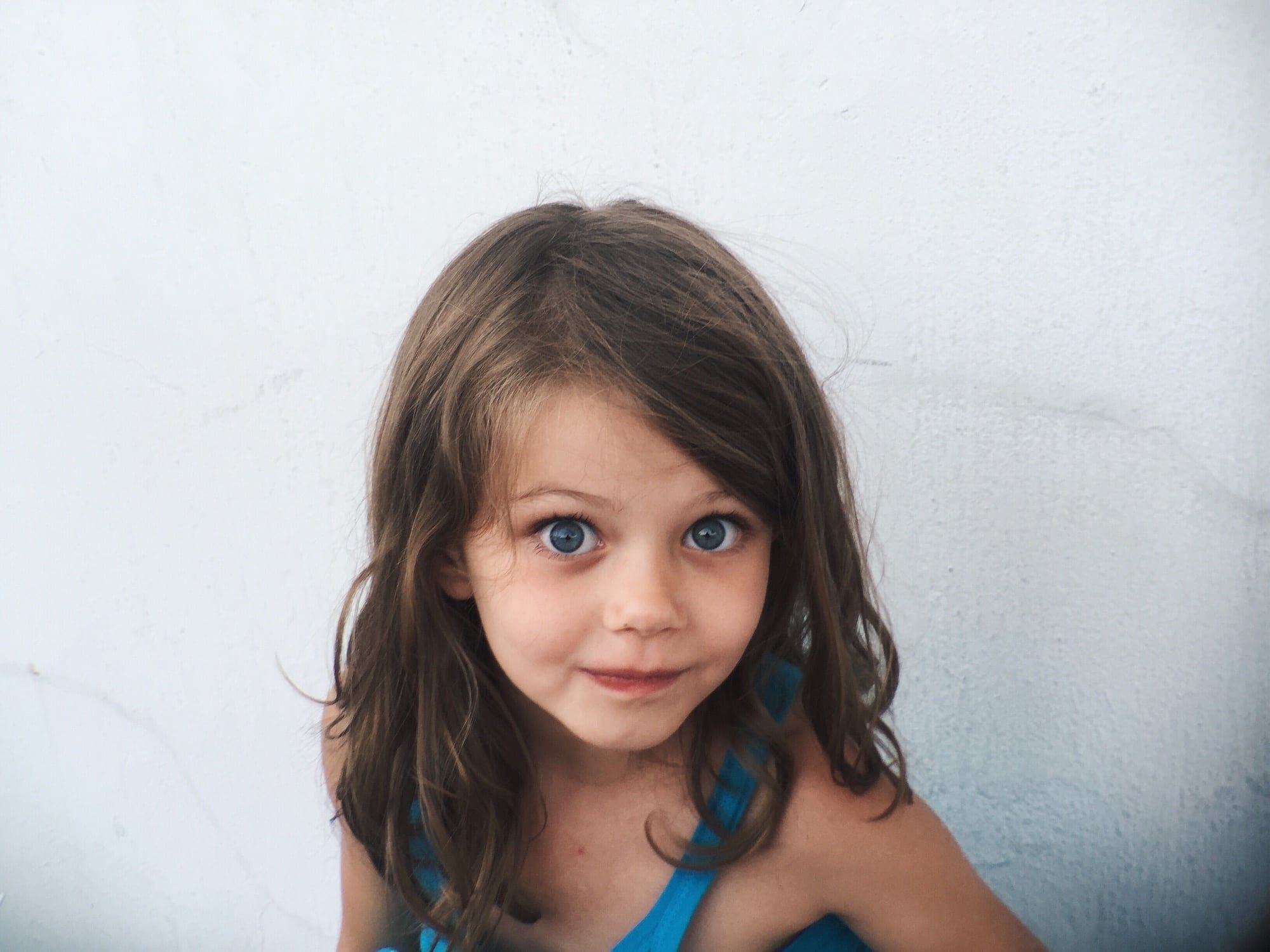 little-girl-looking-at-the camera-how-to-prevent-lice