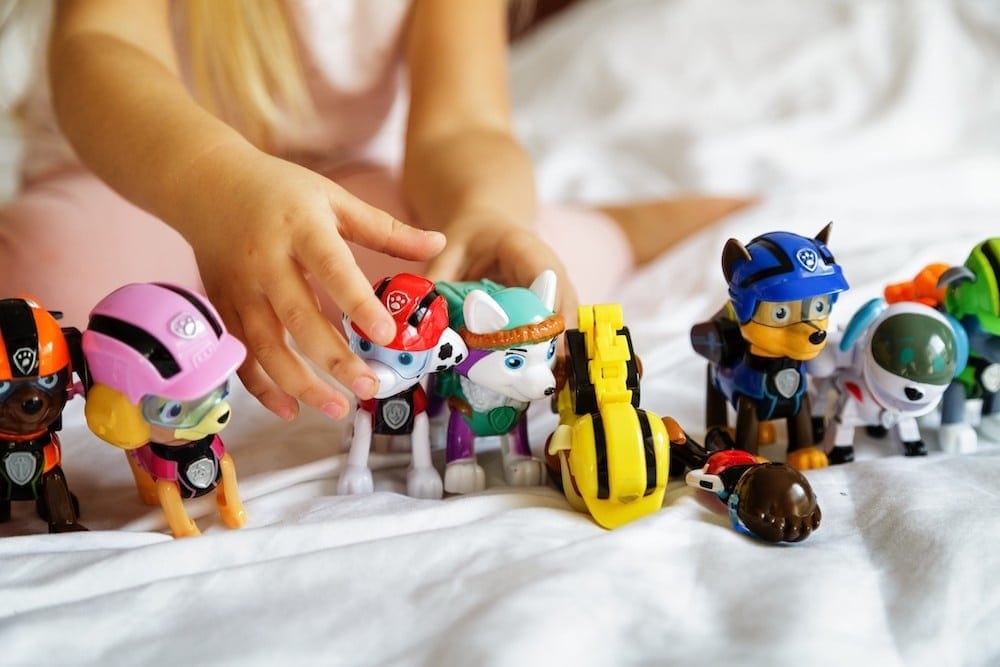 child playing with paw patrol toys