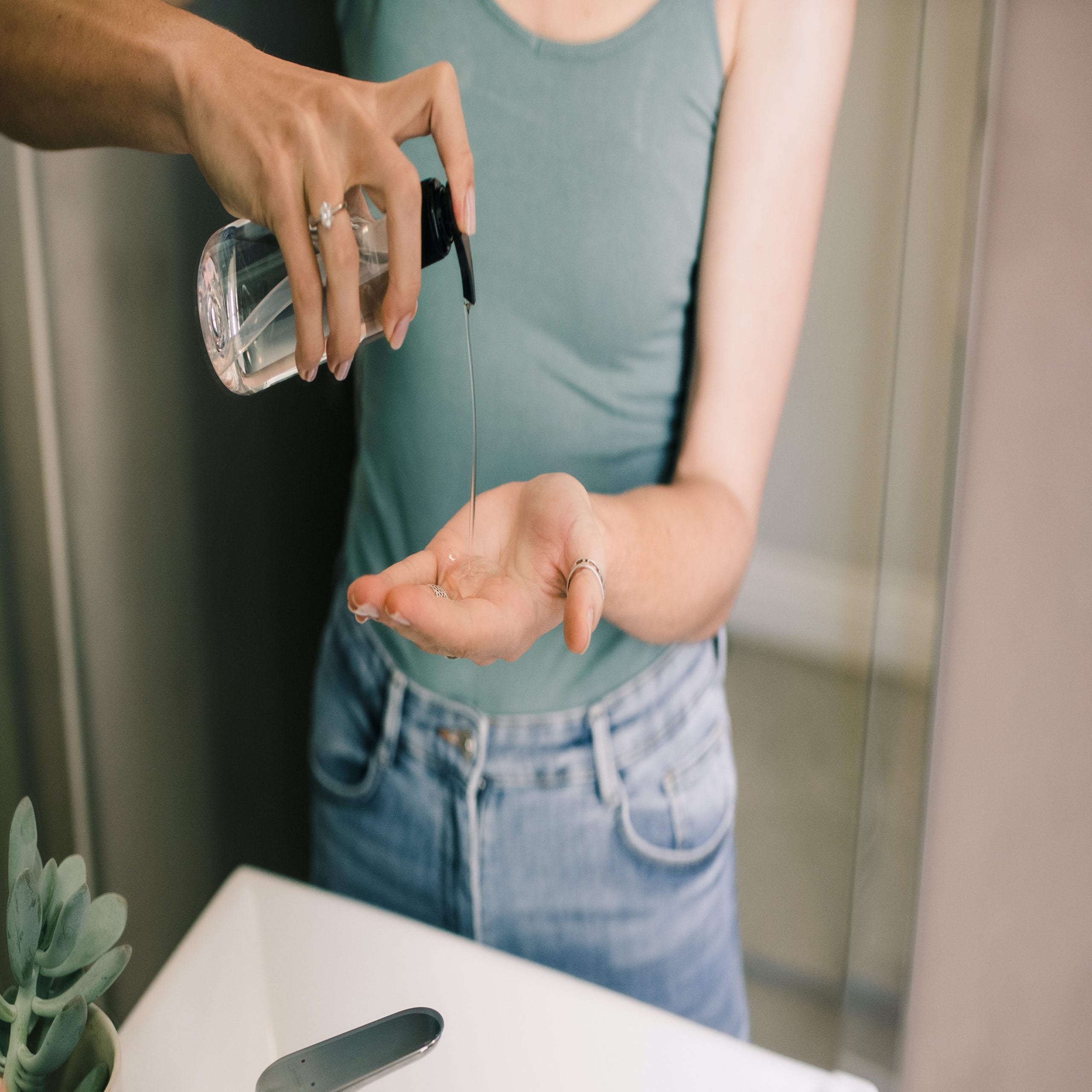 woman using hand sanitizer