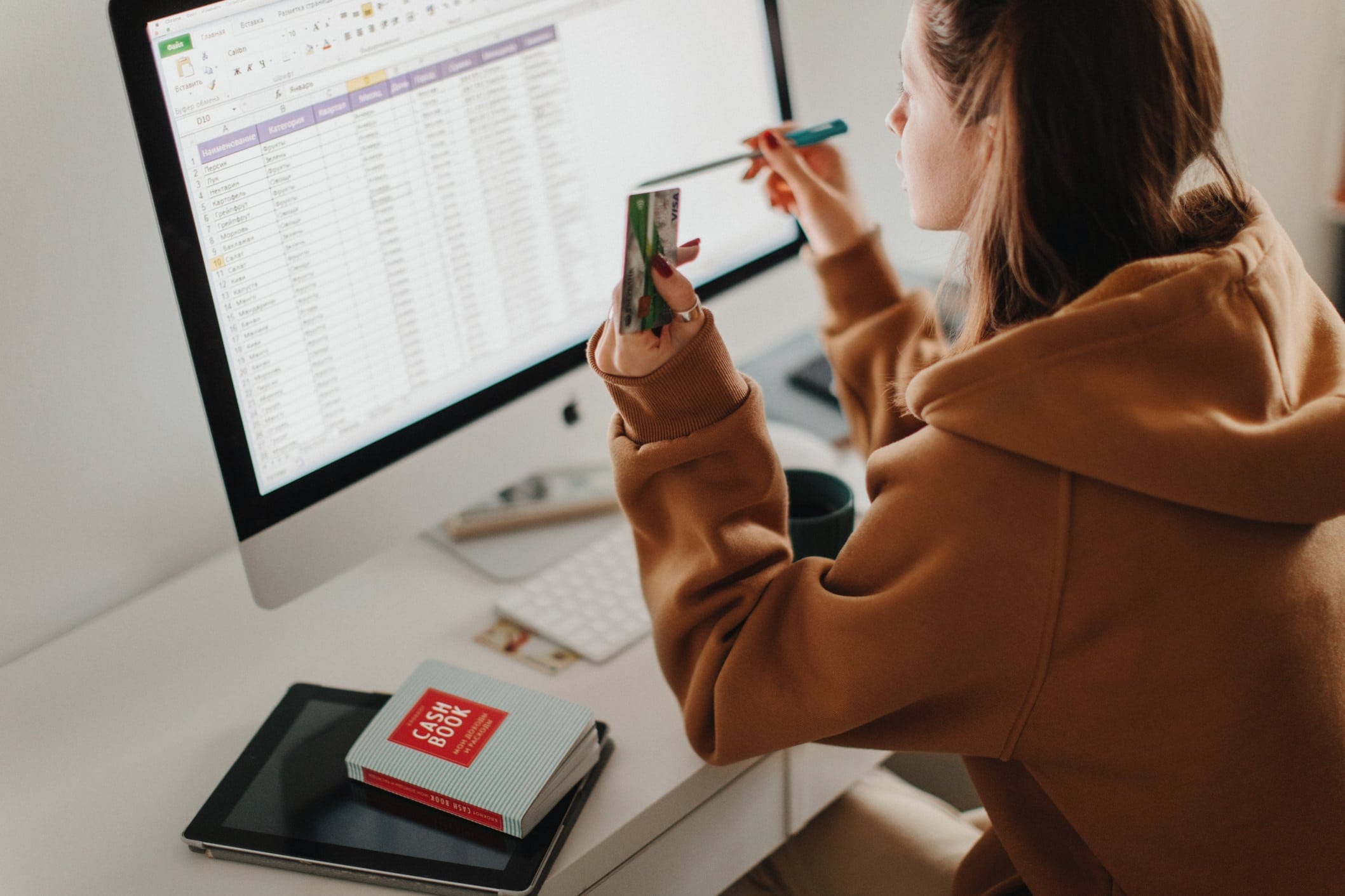 woman working on a budget on a computer