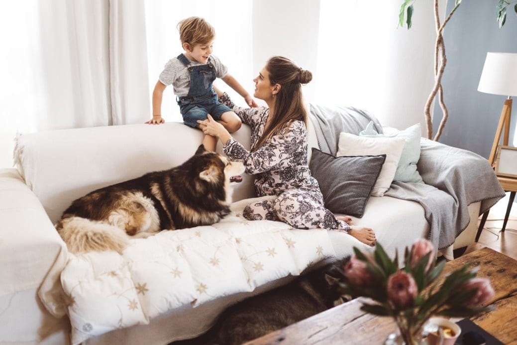 mom talking to son on bed