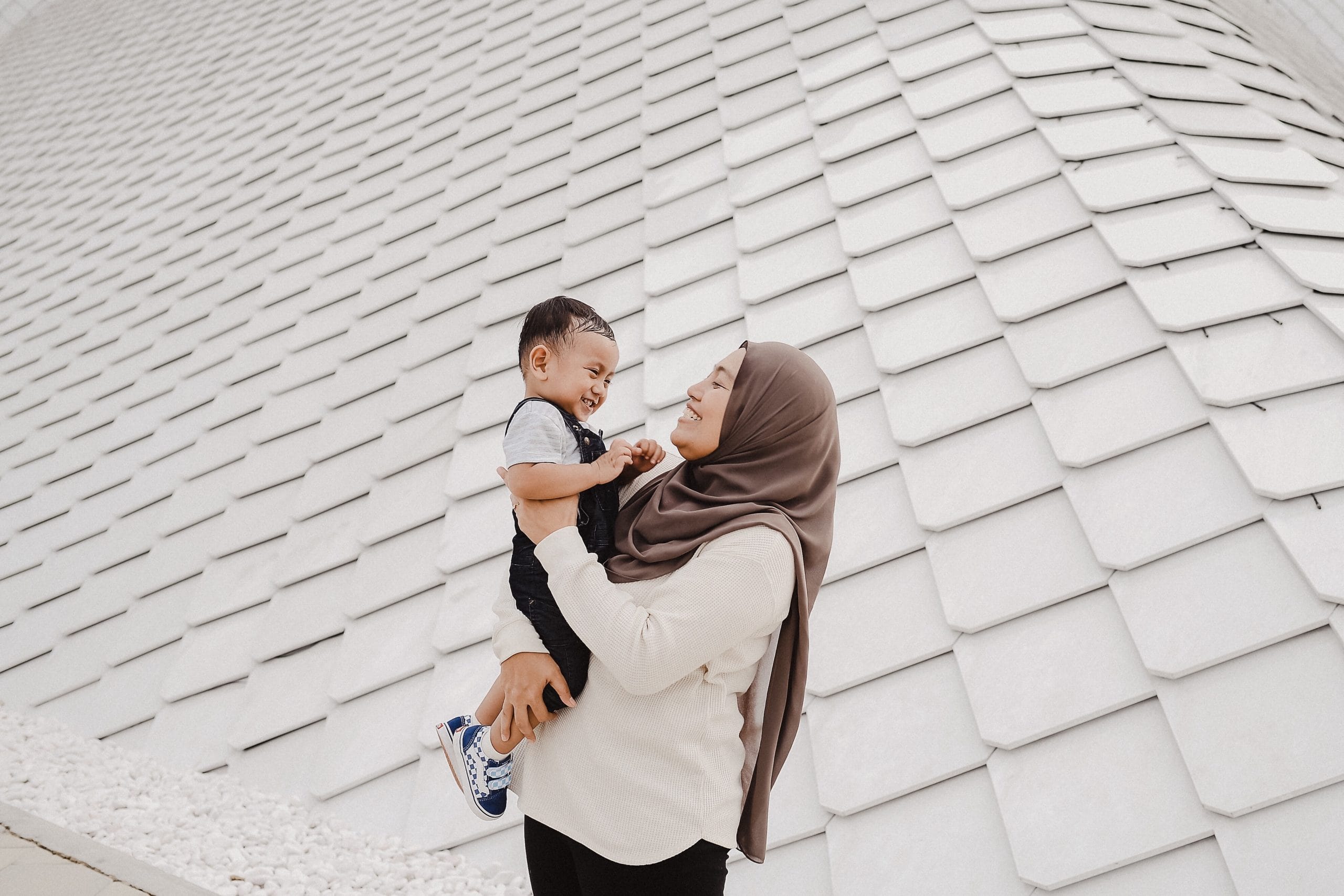 mom holding toddler