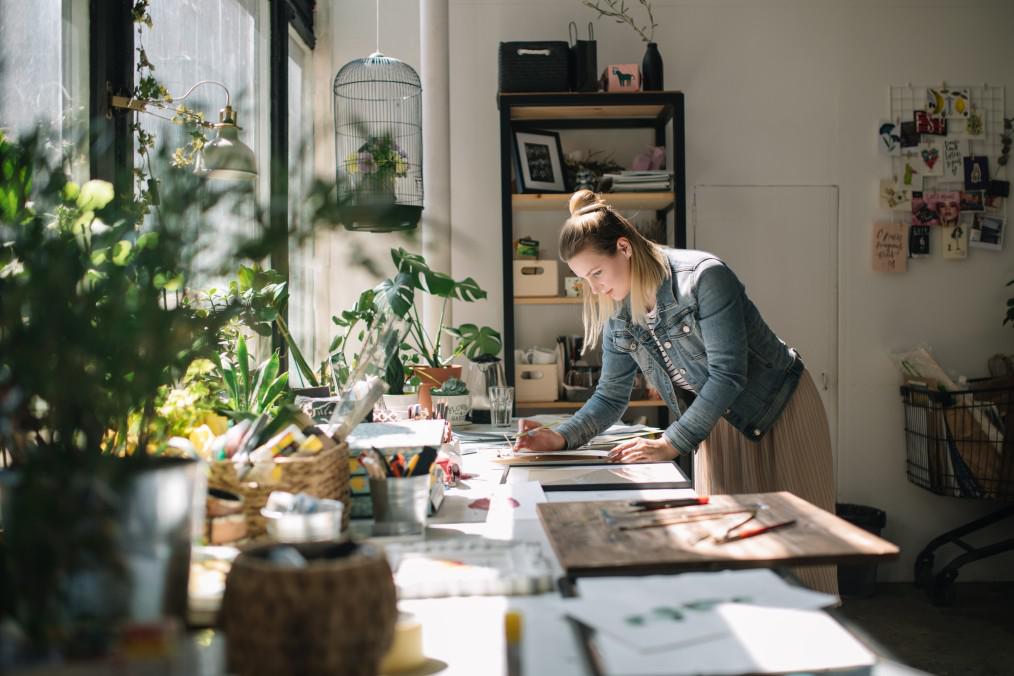 woman working in an office considering career moves before pregnancy