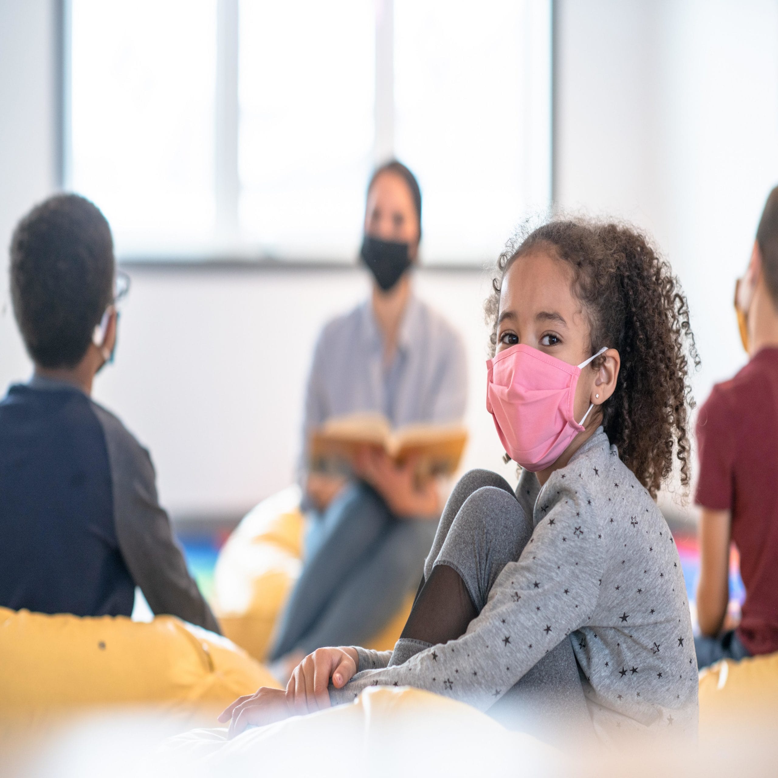 child wearing a mask at school