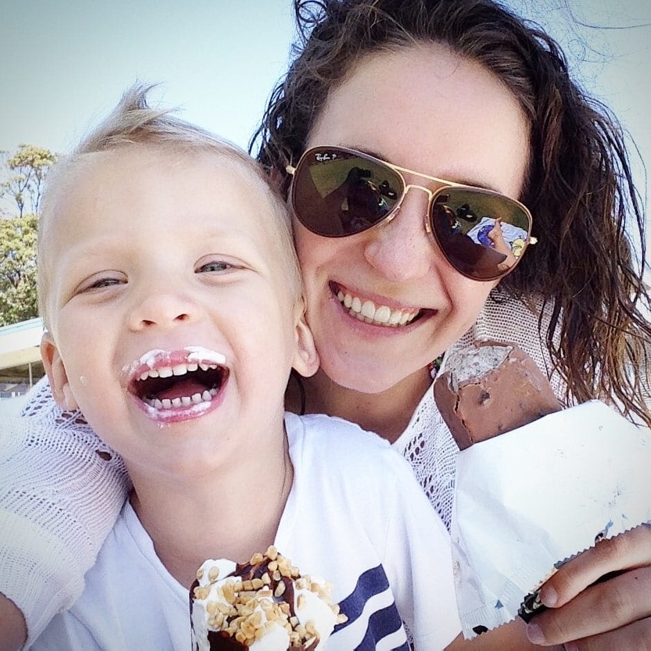 smiling mom and son taking selfie