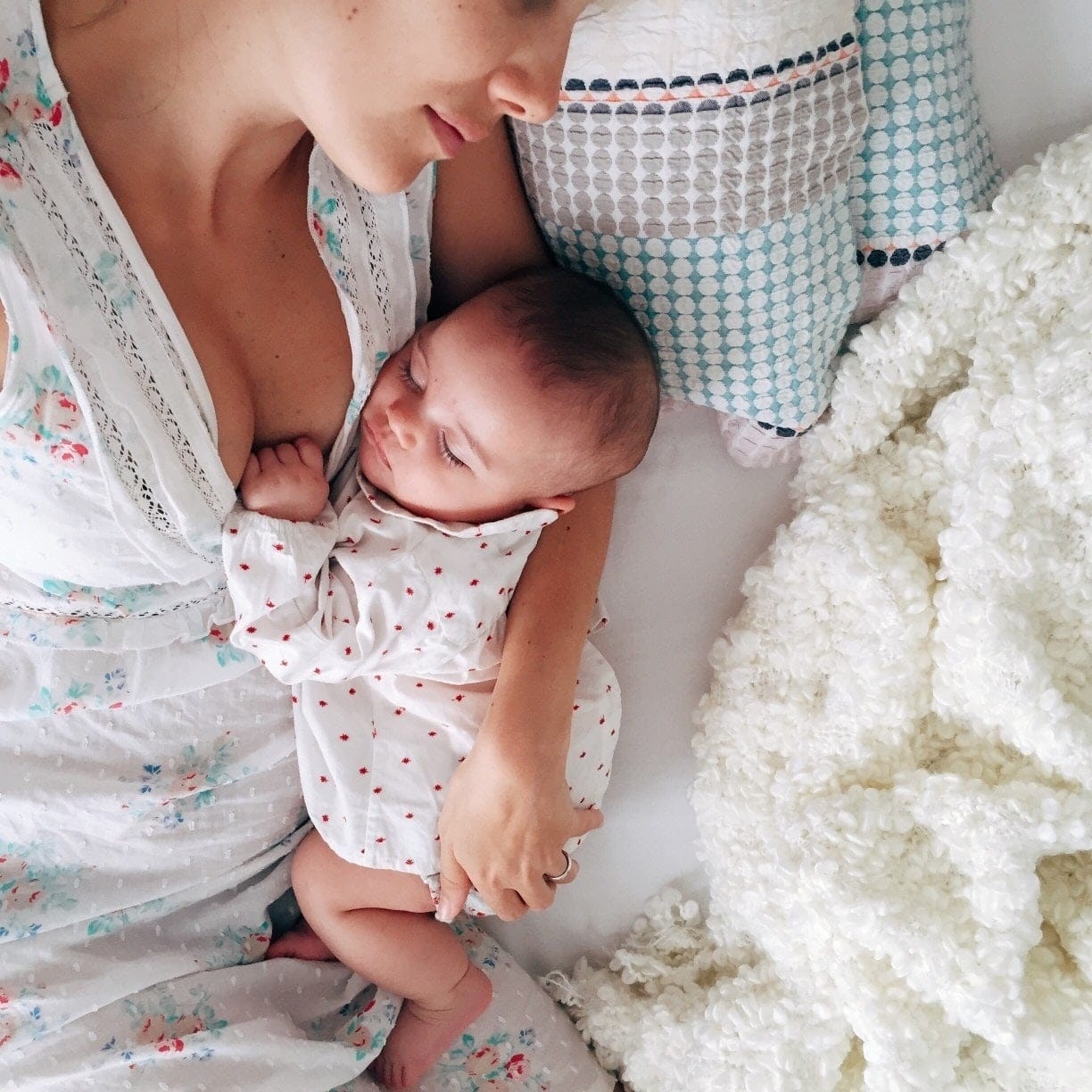 baby and mom laying together