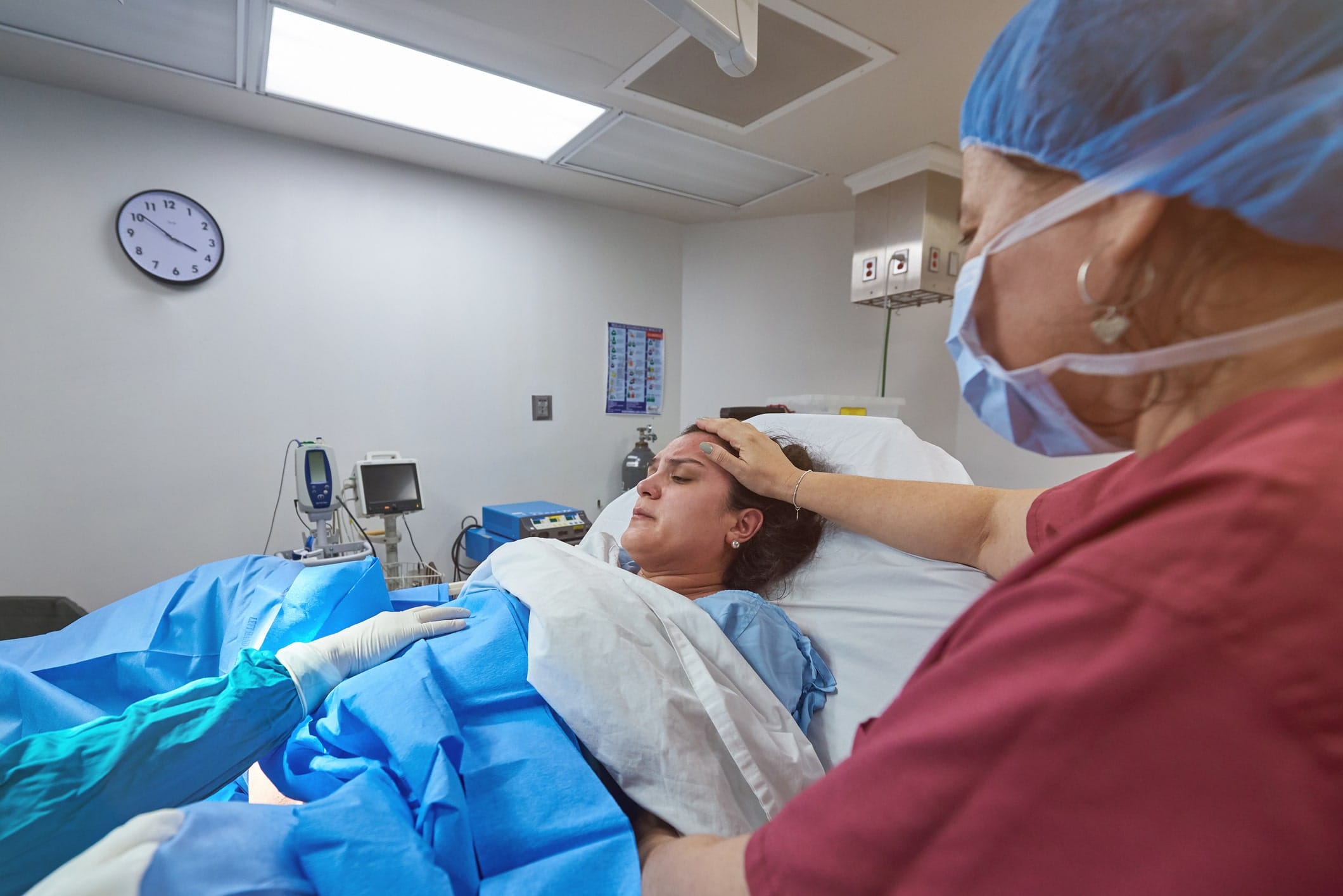 woman in a hospital bed giving lab