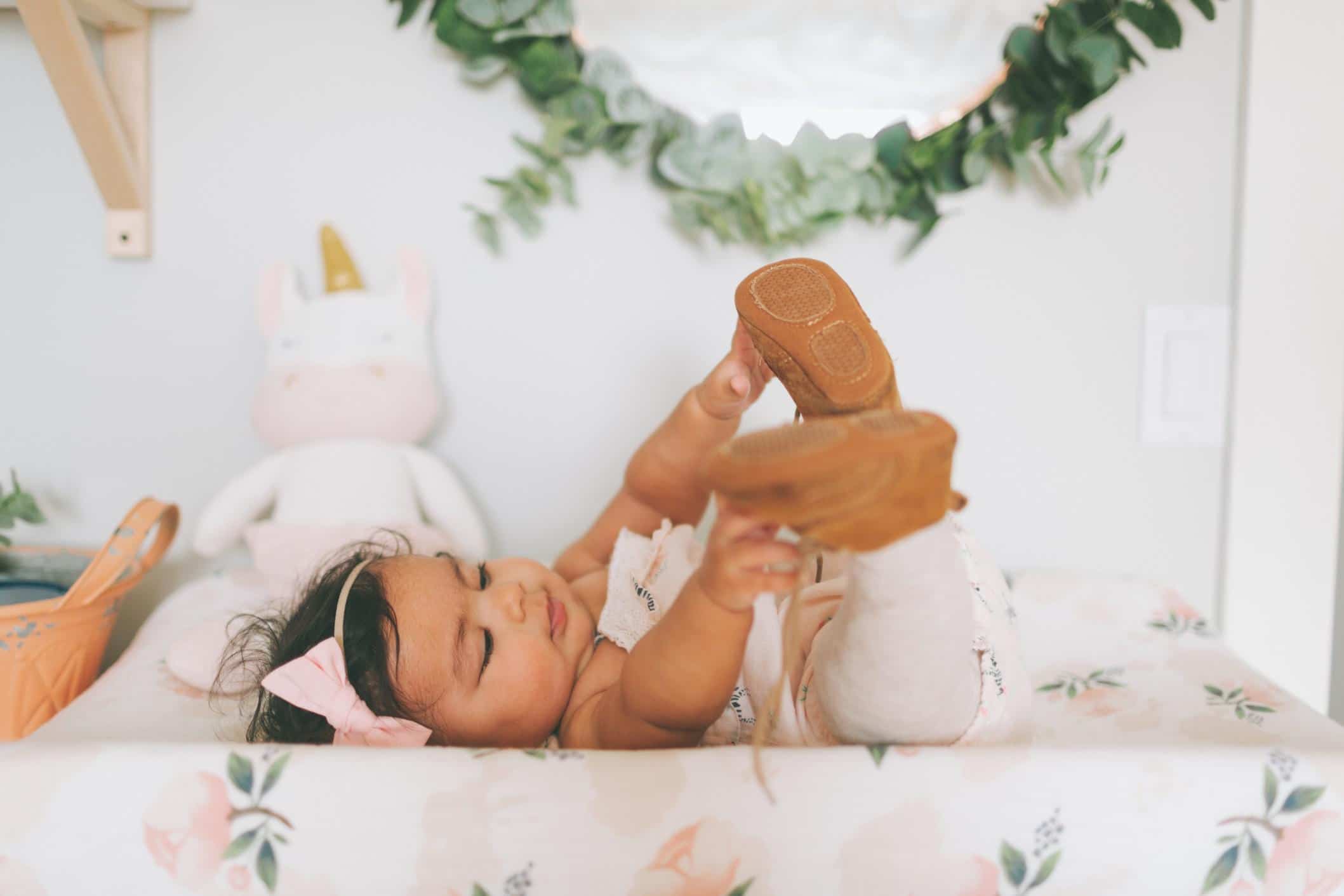 little girl reaching for her toes- virgo baby names