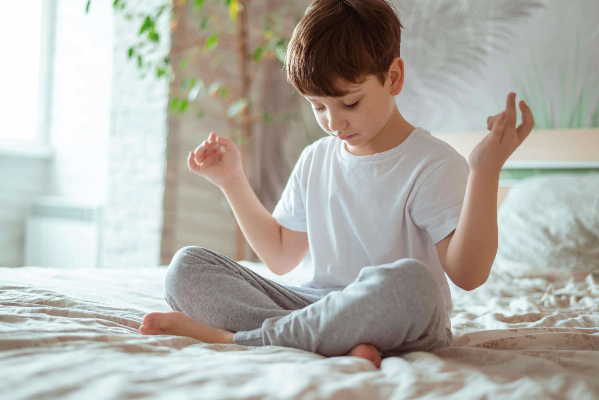 little boy doing meditation