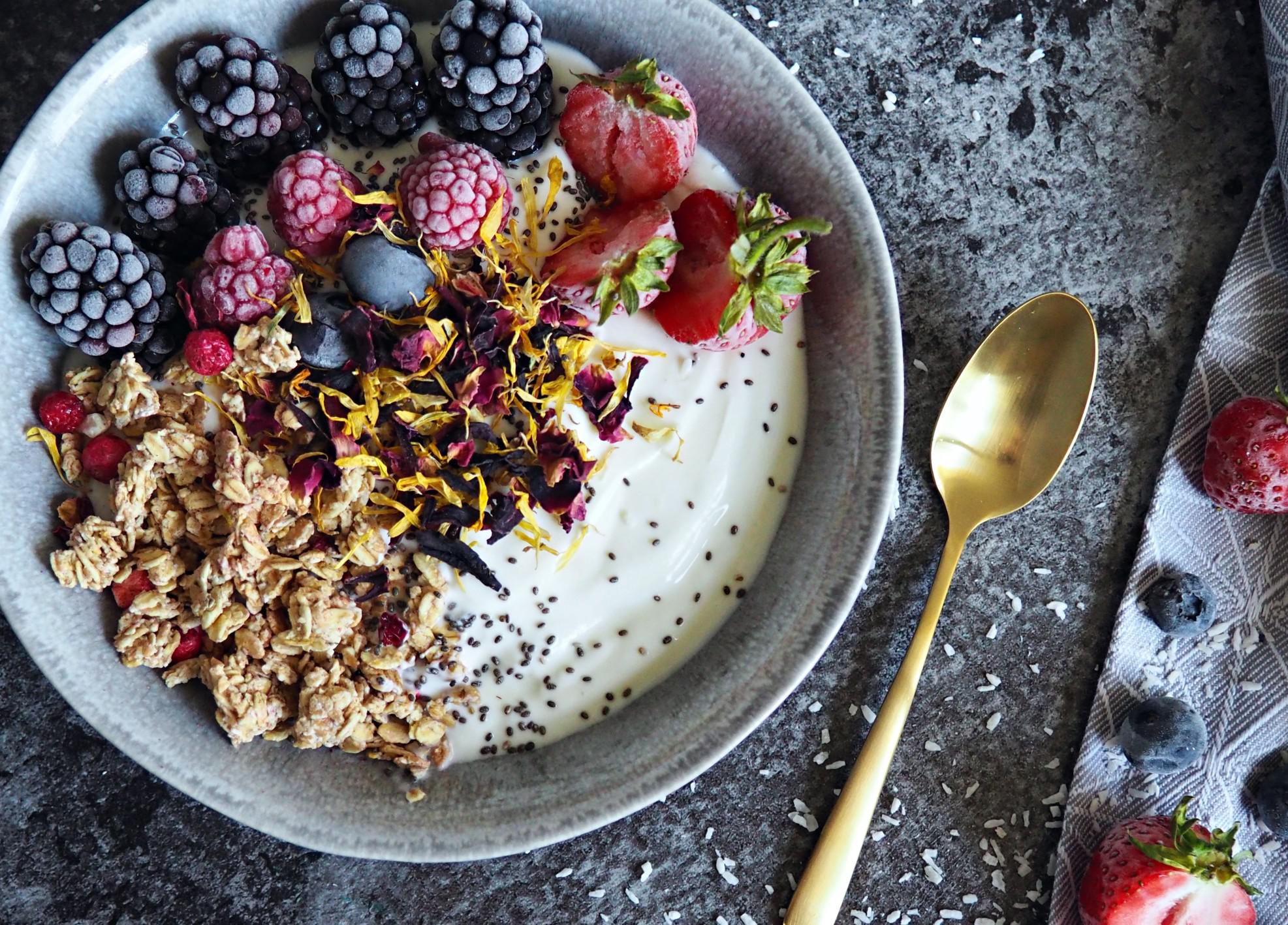 acai bowl with a spoon on a table