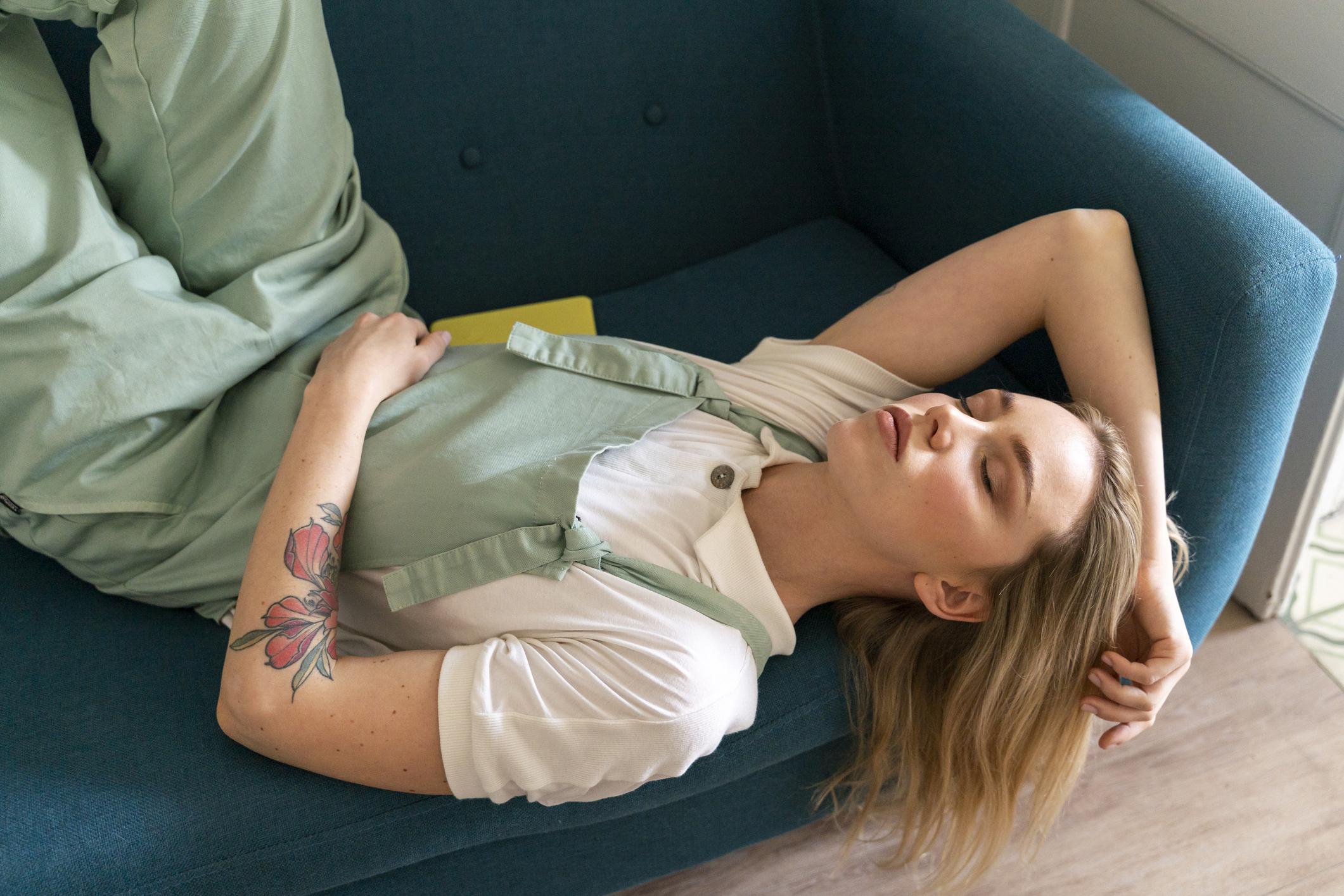 woman sleeping on a couch