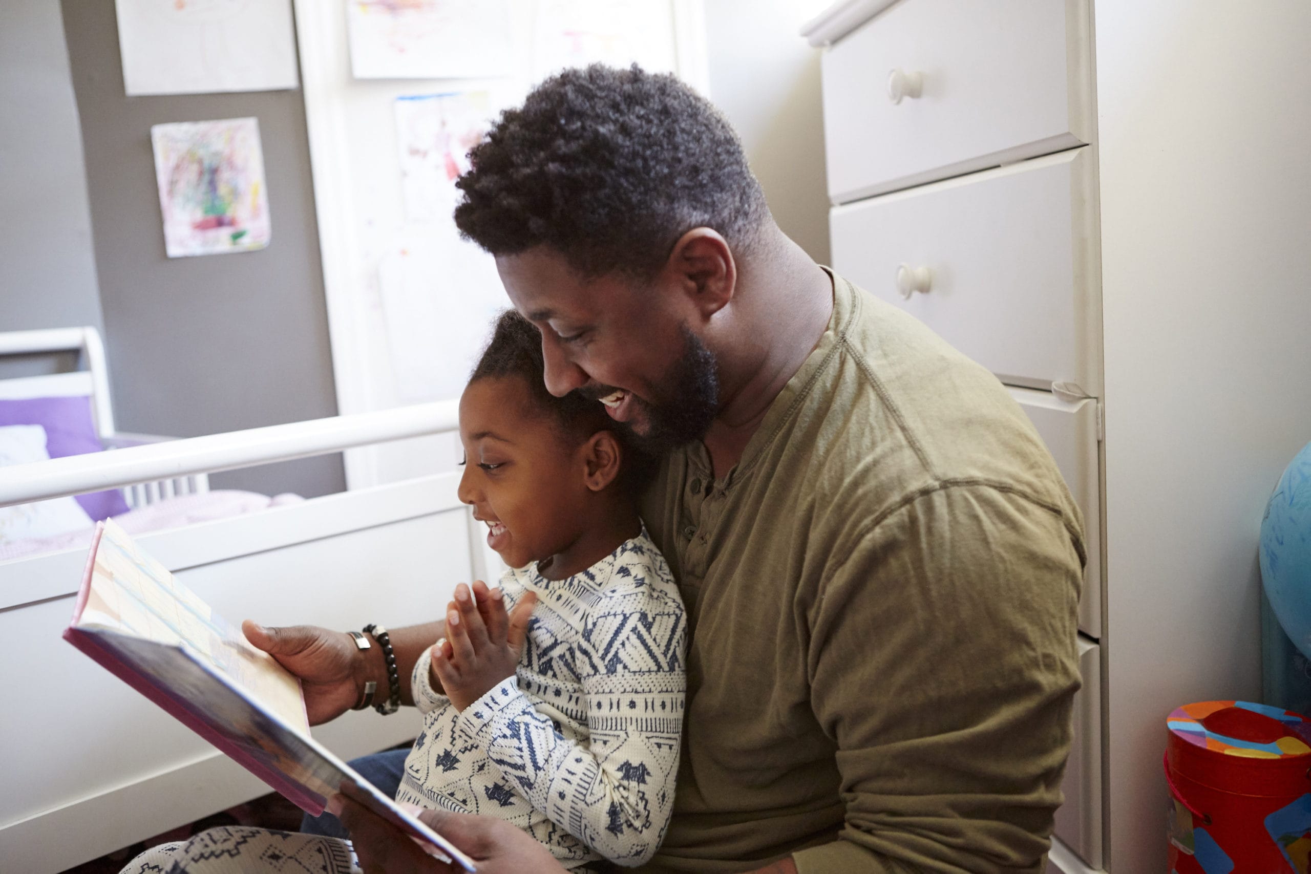 dad reading a book to a child