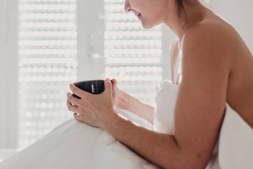 woman holding a cup of coffee