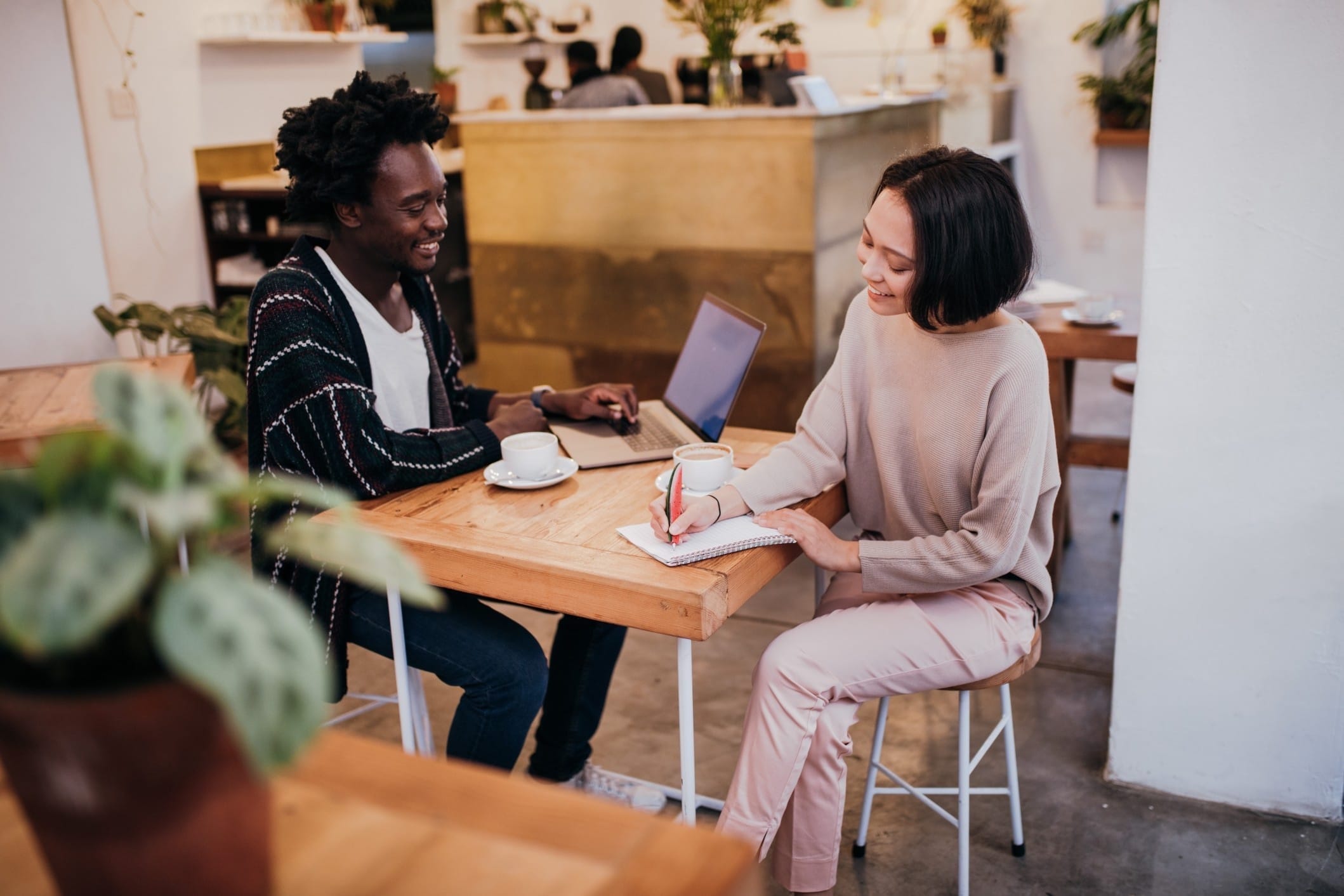 couple working on budget at a cafe - financial accounts parents need