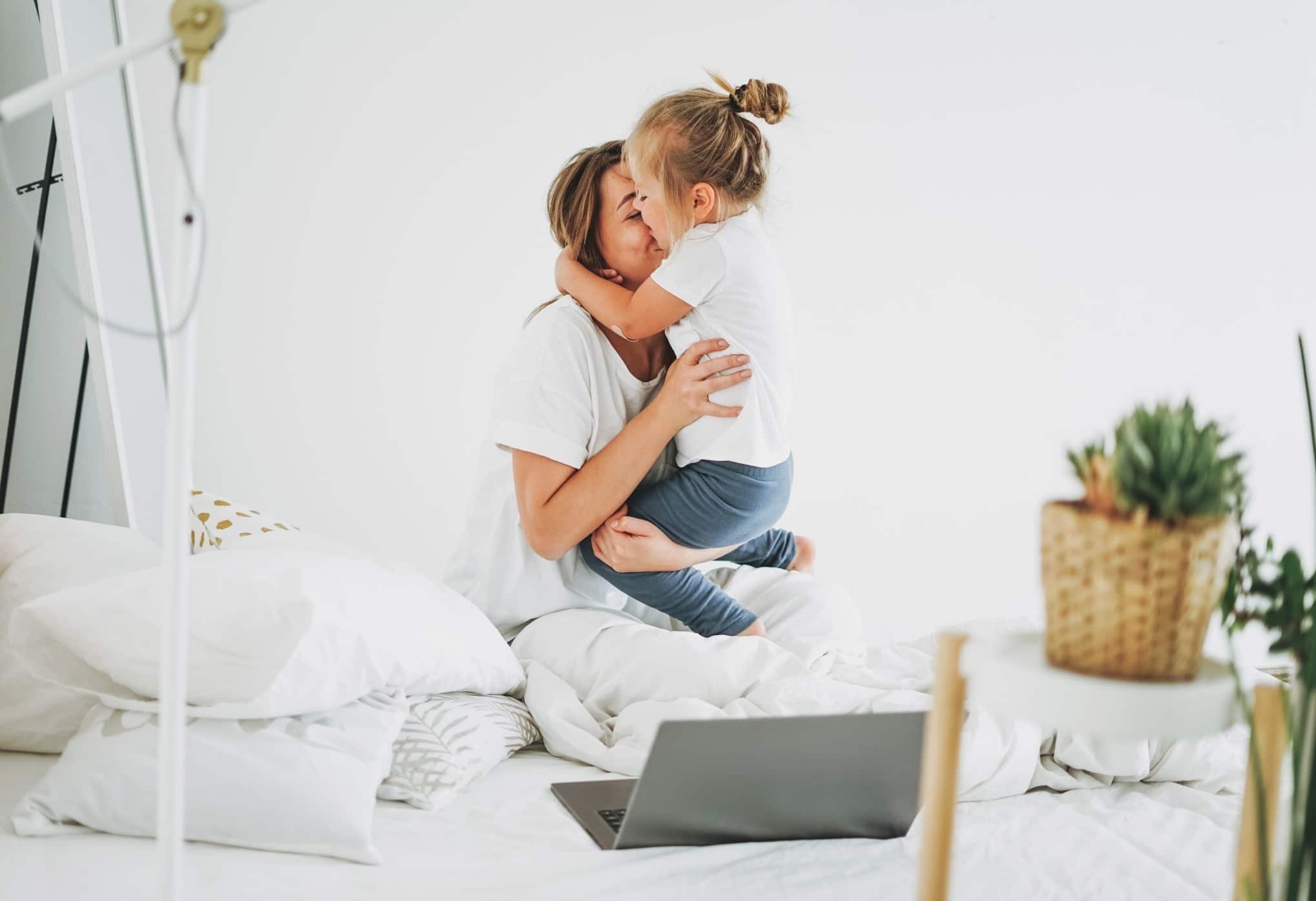 mom playing with little girl