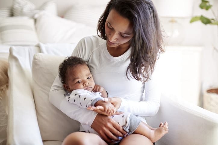 mom holding newborn baby