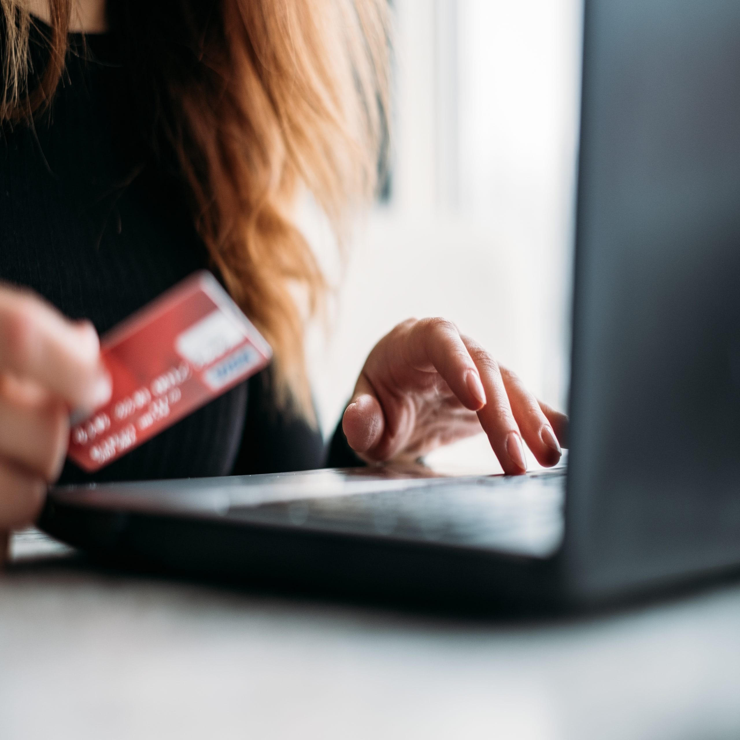 woman online shopping with a credit card