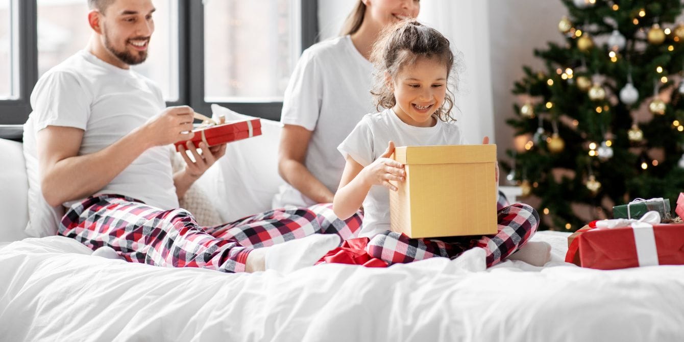 family wearing matching holiday pajamas