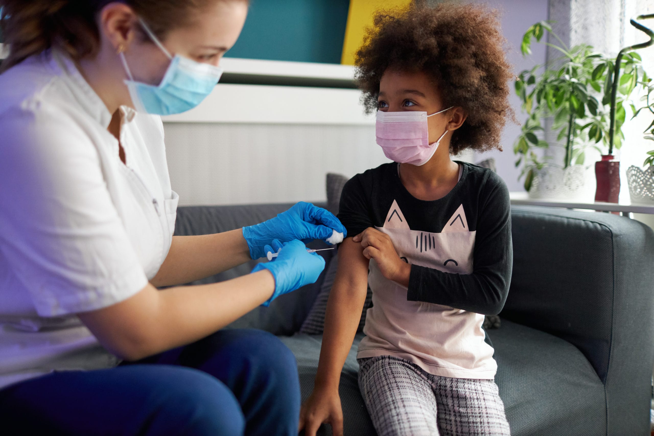 child getting vaccinated at doctor's office