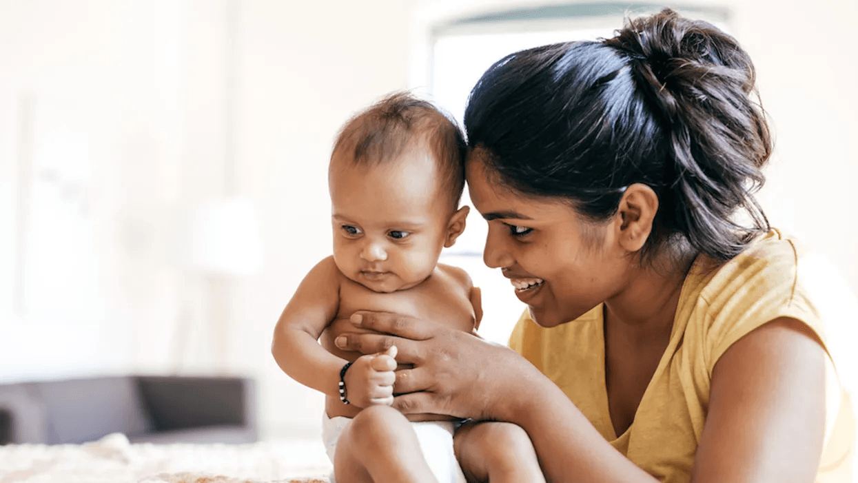 mom holding new baby