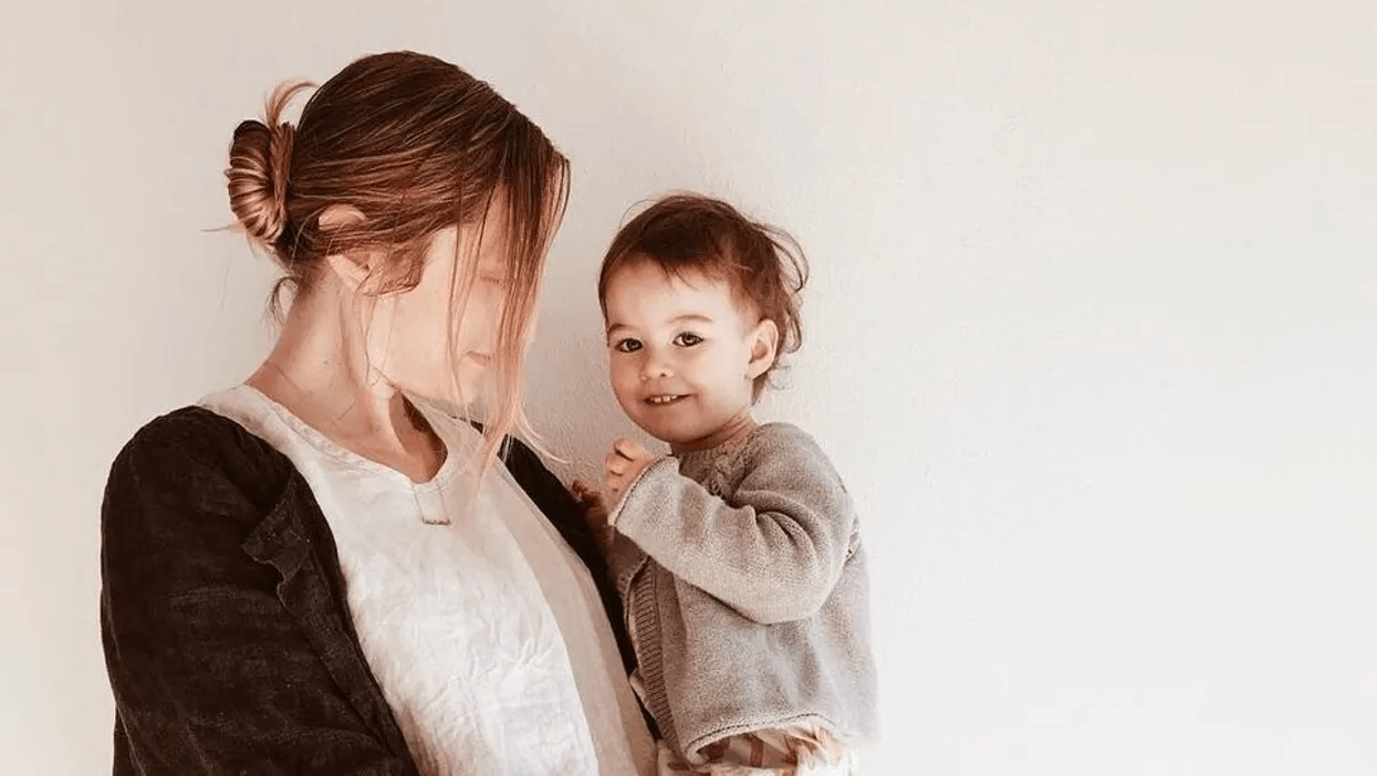 woman holding toddler