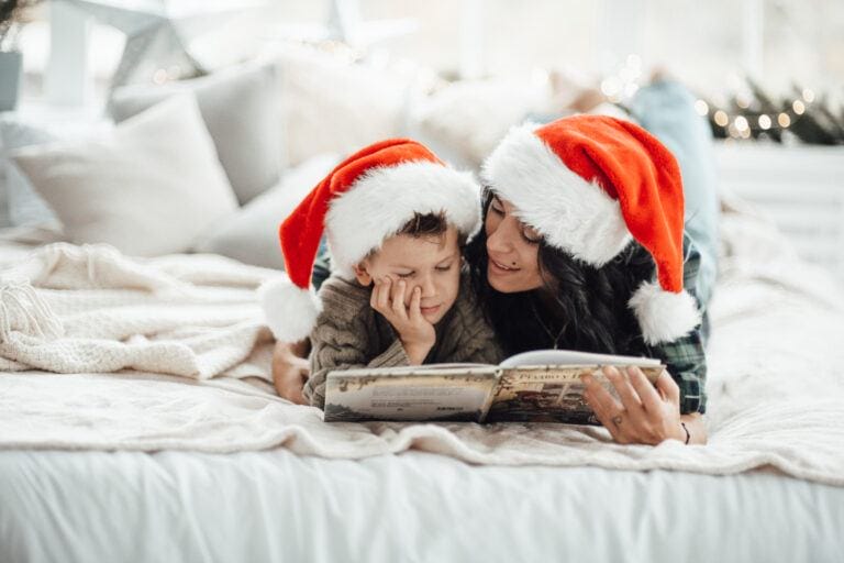 Mother and son reading Christmas books