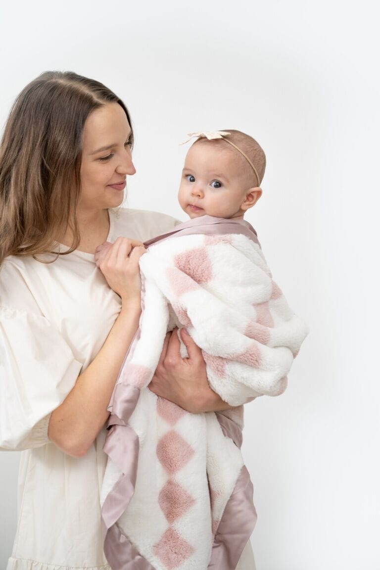 a woman holding a baby