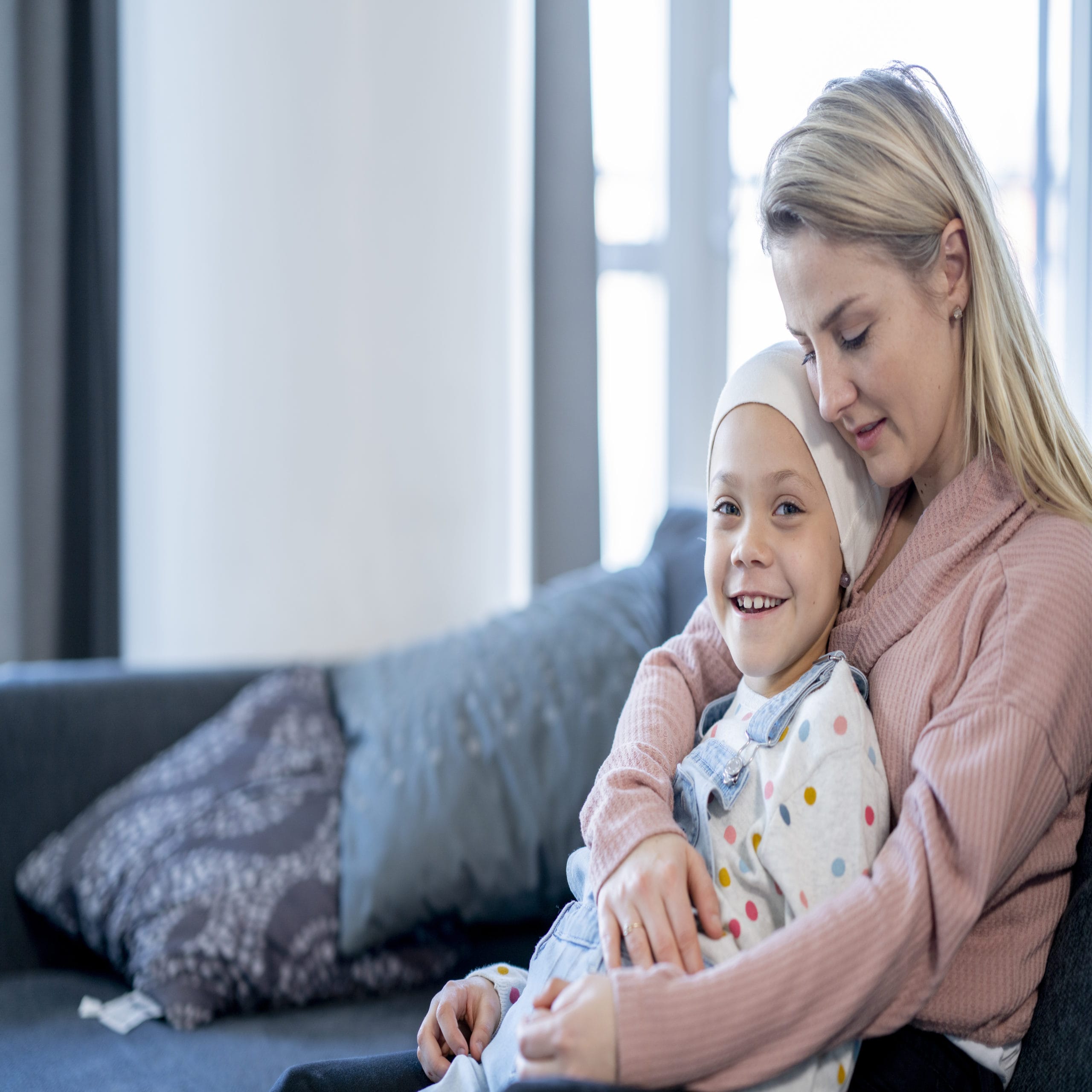 Mother Embracing Her Daughter with Cancer