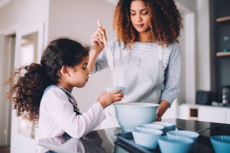 kid helping in kitchen