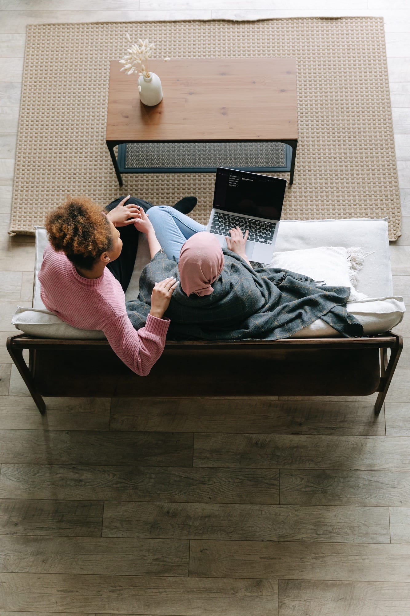 couple looking at laptop on the couch