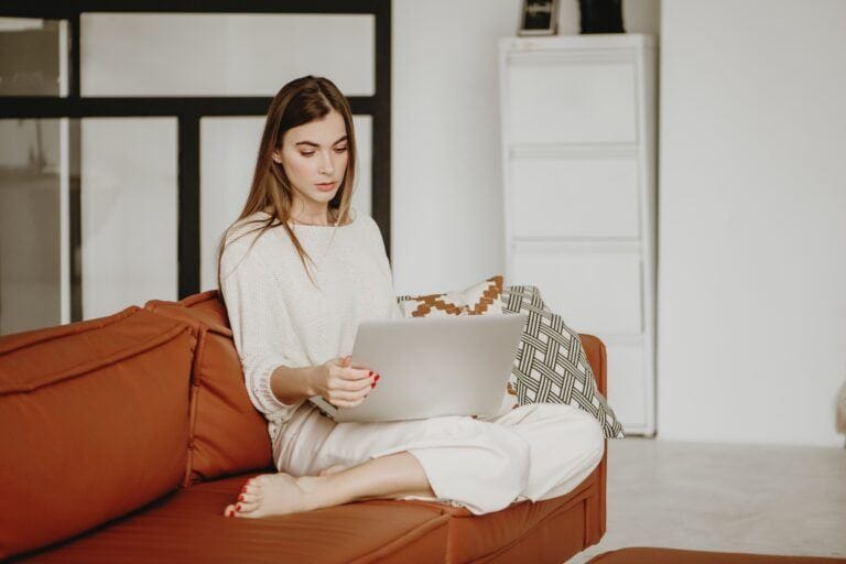 young woman working from home on laptop t20 4eA9nO Motherly