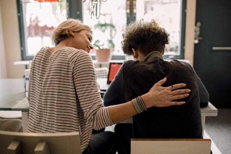 mom and son sitting together- Raising teens