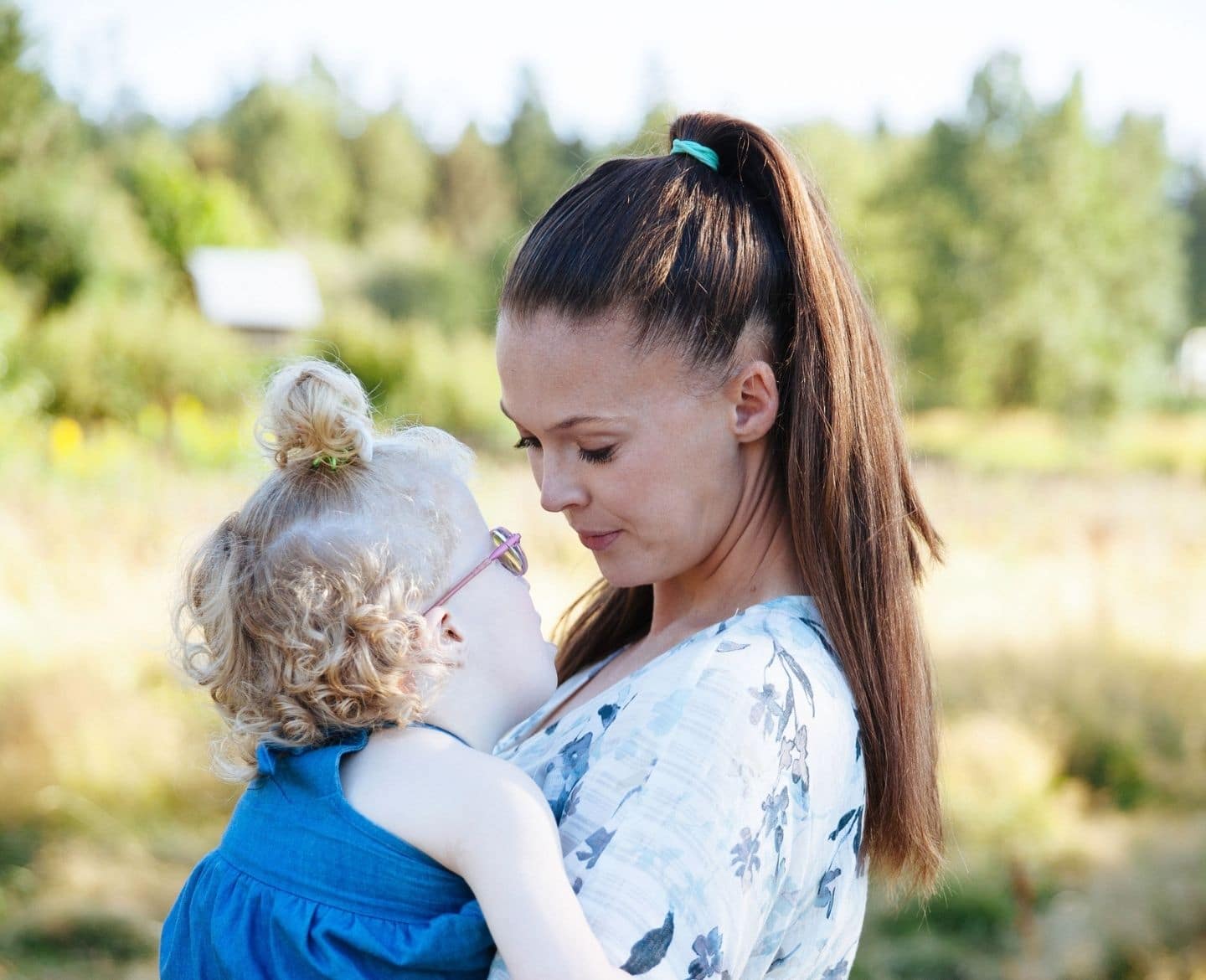 mother holding daughter