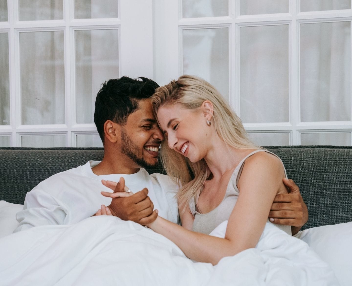 couple cuddling in bed