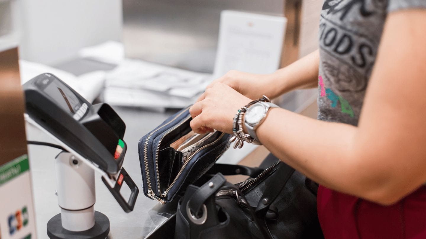 woman opening wallet- inflation money tips