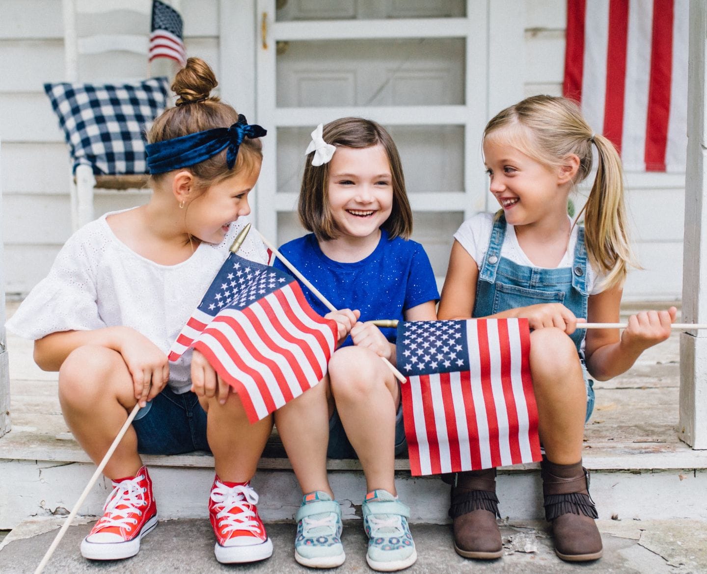 kids holding american flags- 4th of july memories