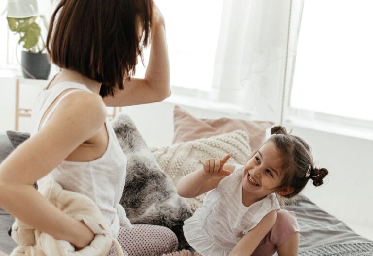 mom and daughter playing