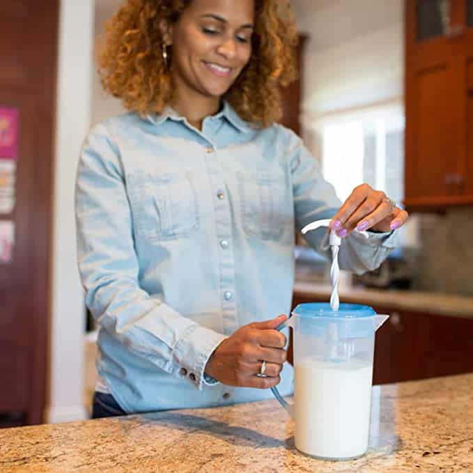 mom mixing formula in Dr. Browns formula pitcher