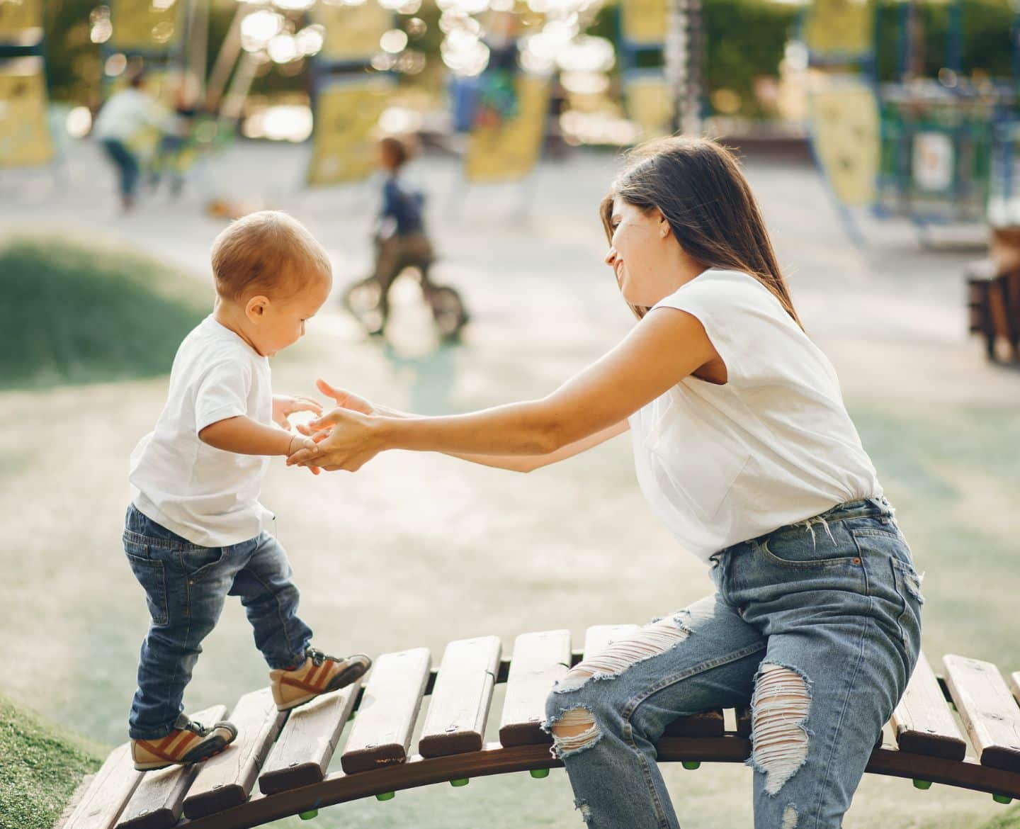 mom and son playing on playground