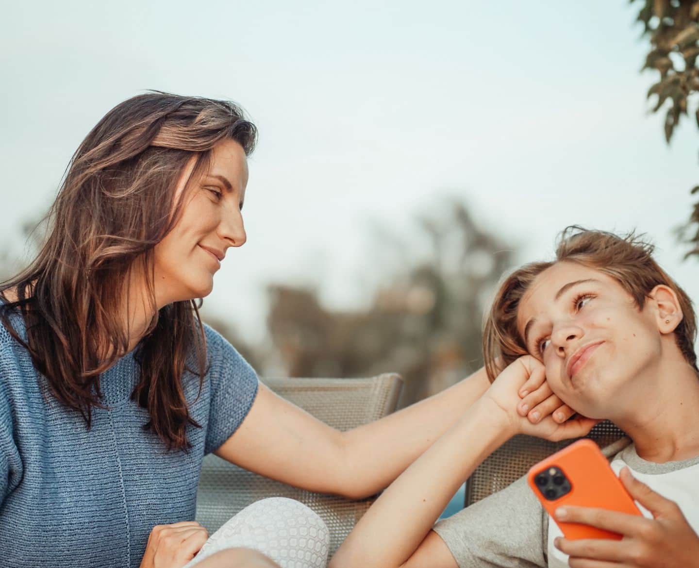 mom smilling at teen son