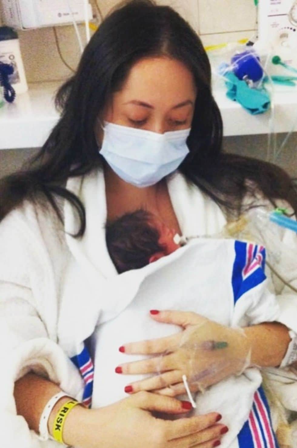 mother holding nicu baby