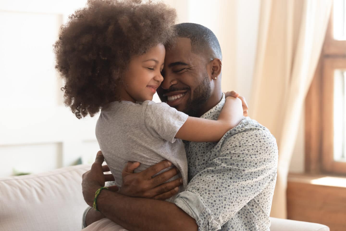 great father hugging daughter