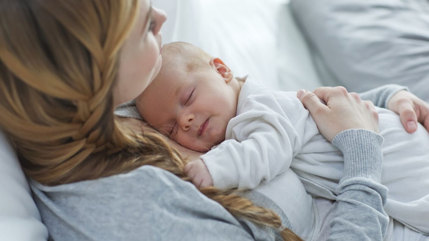 new mom holding baby, wondering about maternal instinct