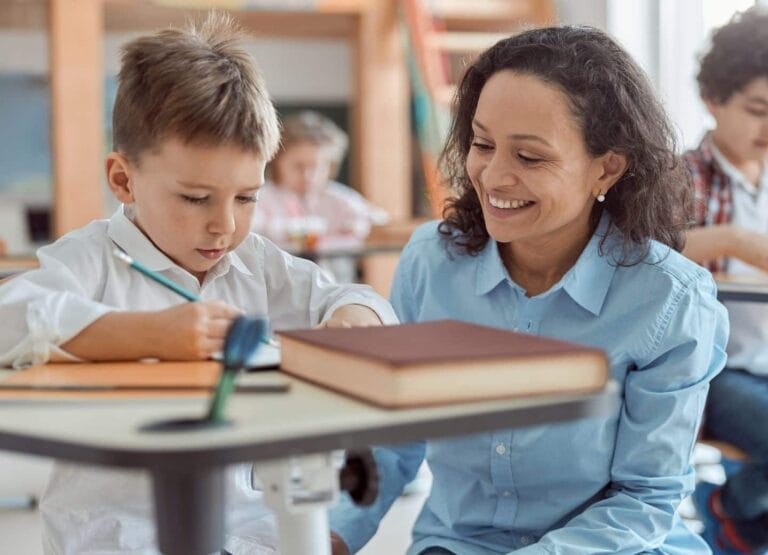 teacher helping student at school - thank you letter to teachers