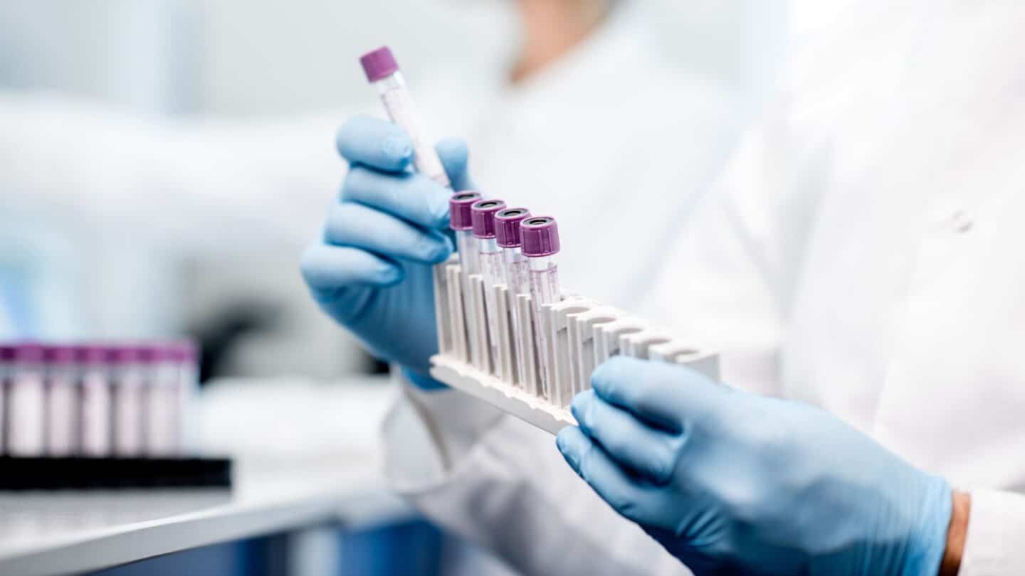 woman using test tubes in a lab