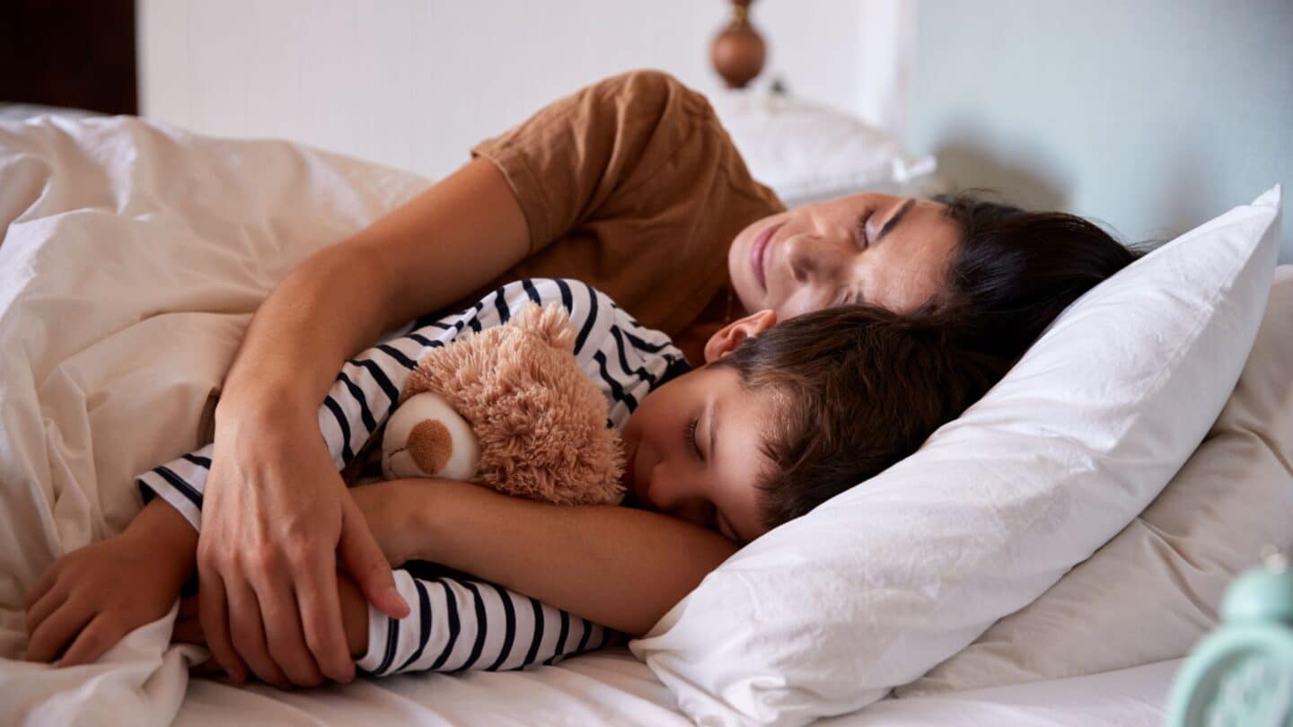 mother done having babies laying in bed with adolescent son