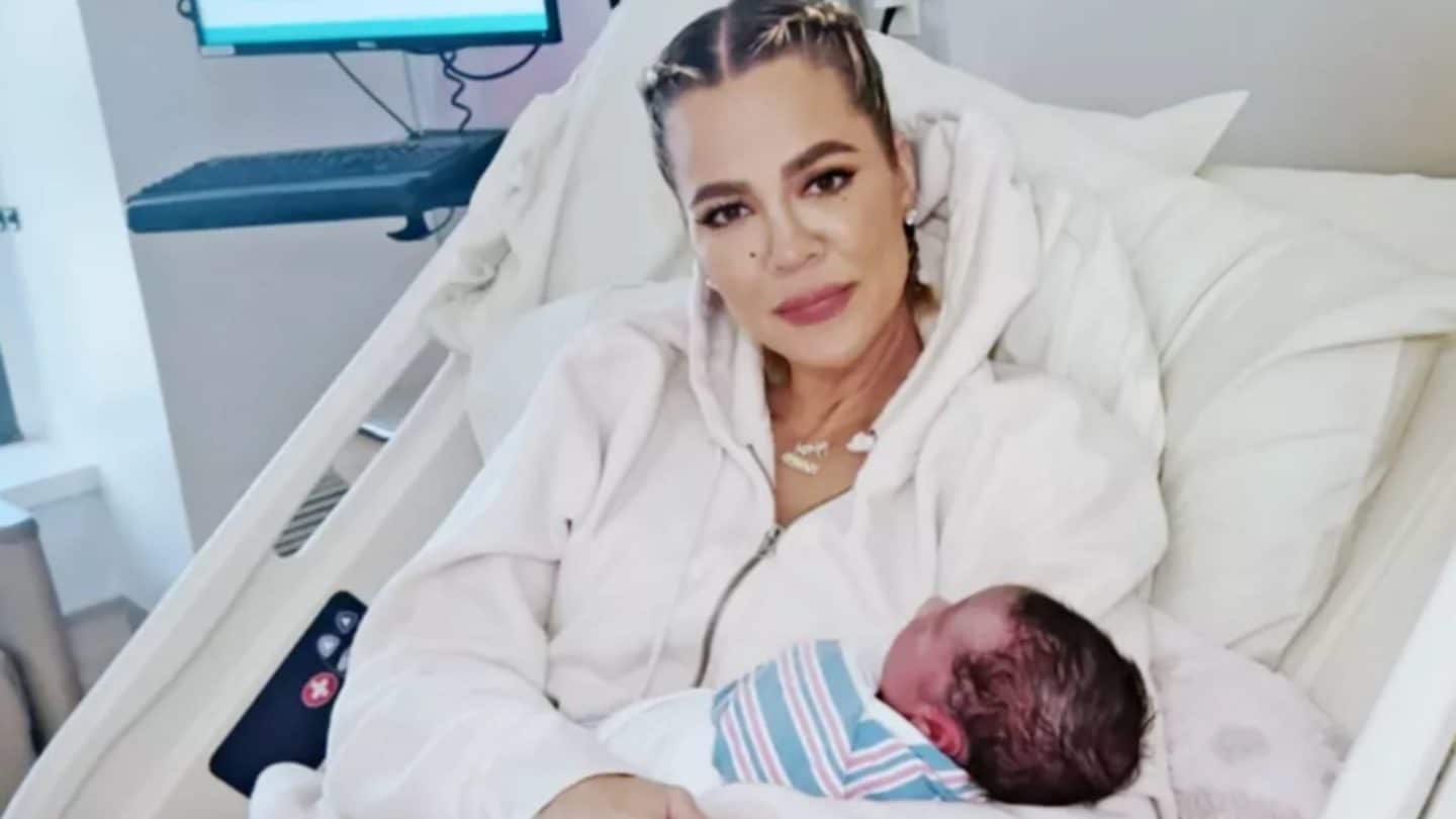 Khloe Kardashian holding newborn son