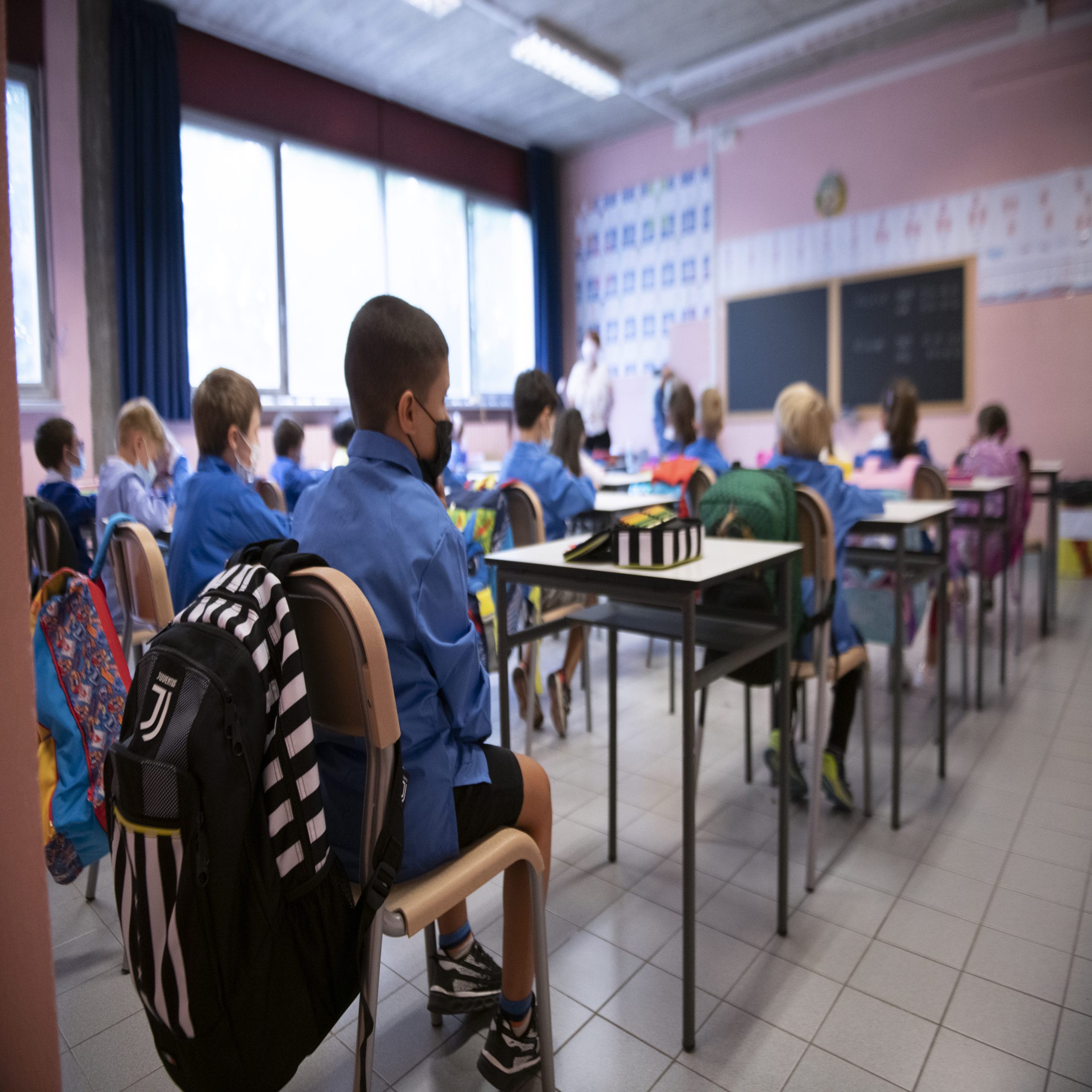 pandemic hurt education - image of kids in classroom