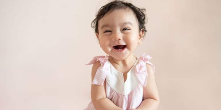 baby girl smiling - girl names that start with t